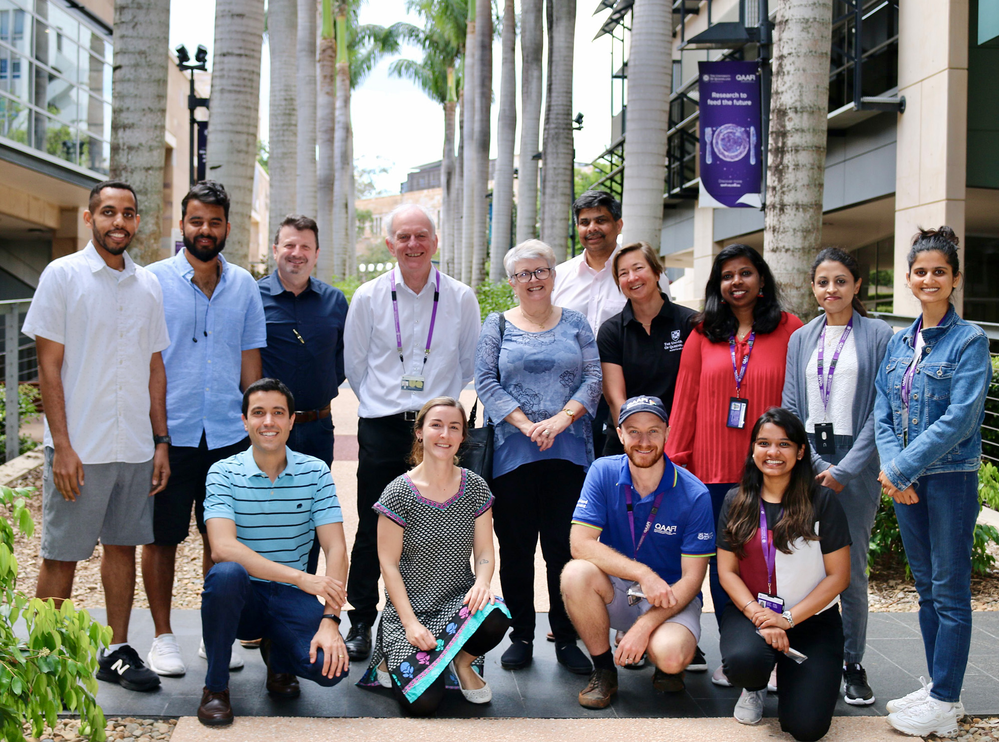 research group photo standing outside Institute of Molecular Biology at UQ 